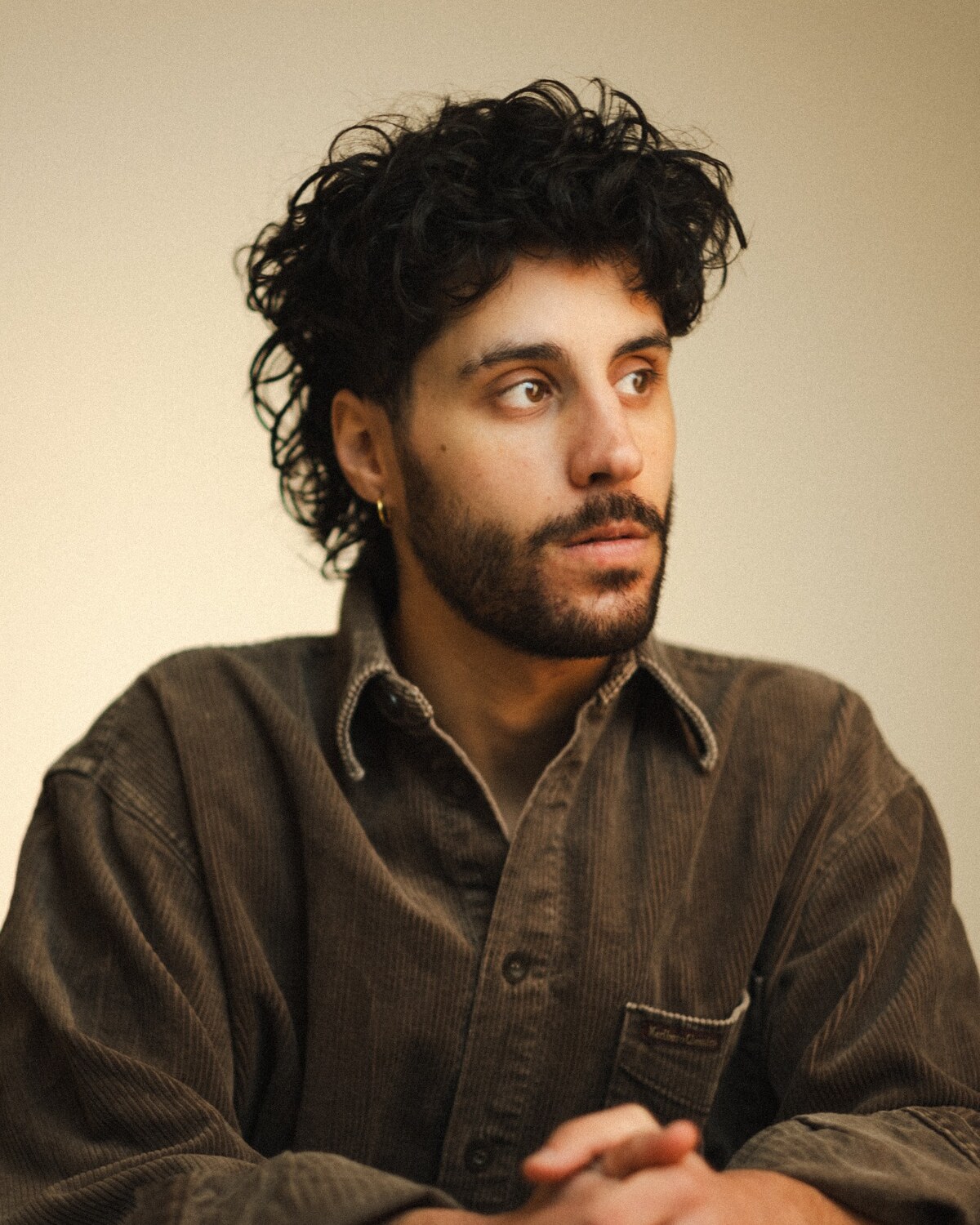 Headshot of Aleksander Varadian photographed by Ash Matthews