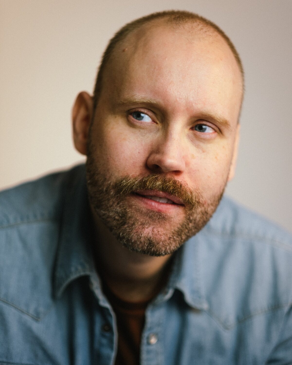 Headshot of Aleksander photographed by Ash Matthews